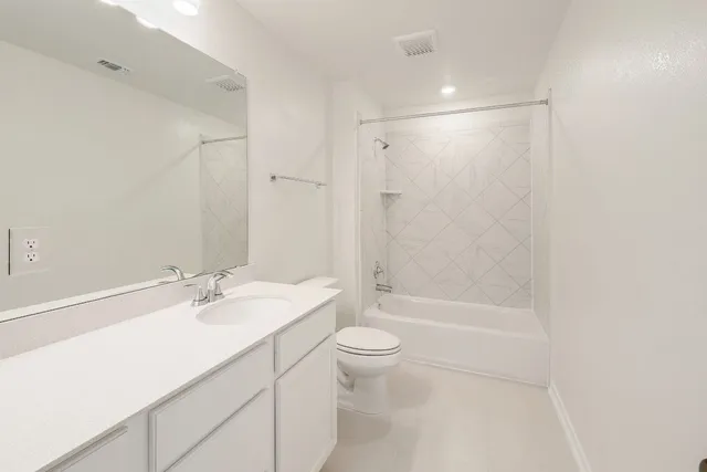 a bathroom with a sink toilet and a mirror