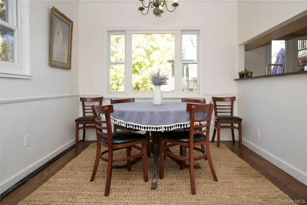 a view of a dining room with furniture and window