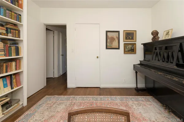 a view of a livingroom with furniture and staircase