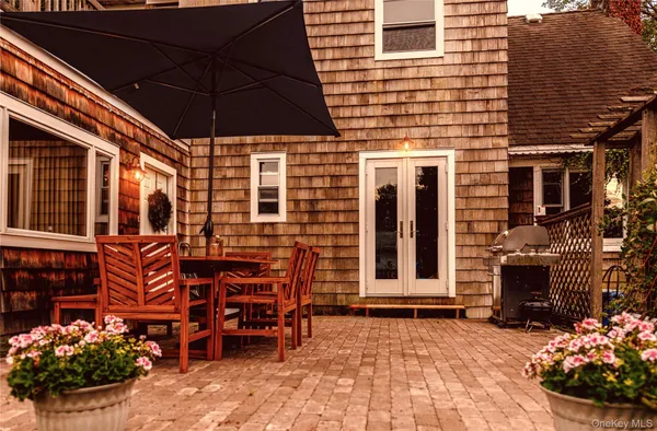 a view of a house with outdoor seating