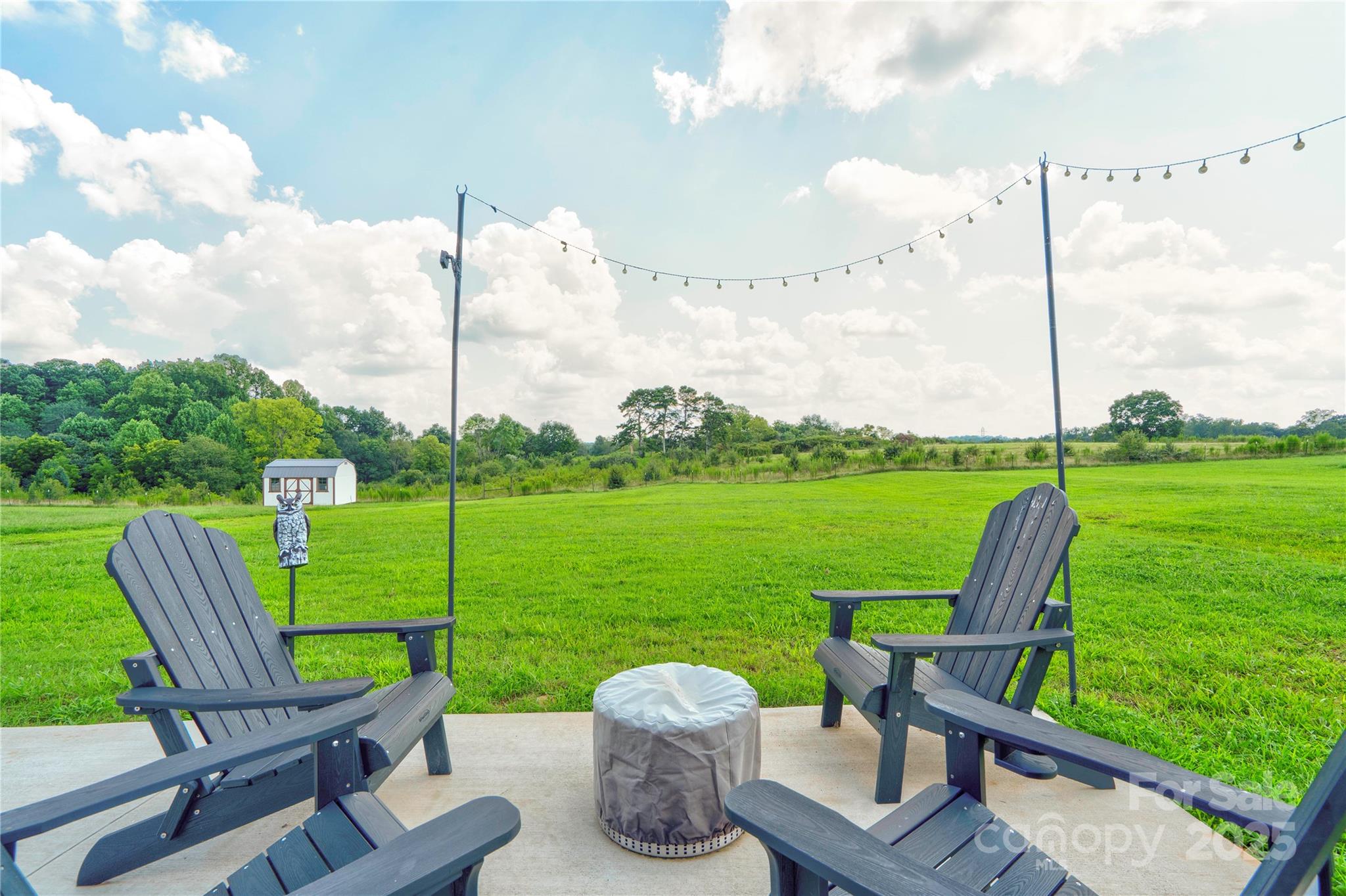 2344 Joes Lake Road Shelby, NC 28152 - Photo 12 of 47 a view of a chair and table in the garden