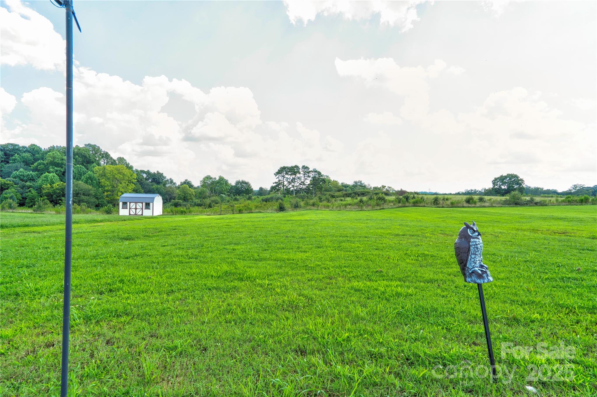 2344 Joes Lake Road Shelby, NC 28152 - Photo 15 of 47 a view of a garden with a building in the background