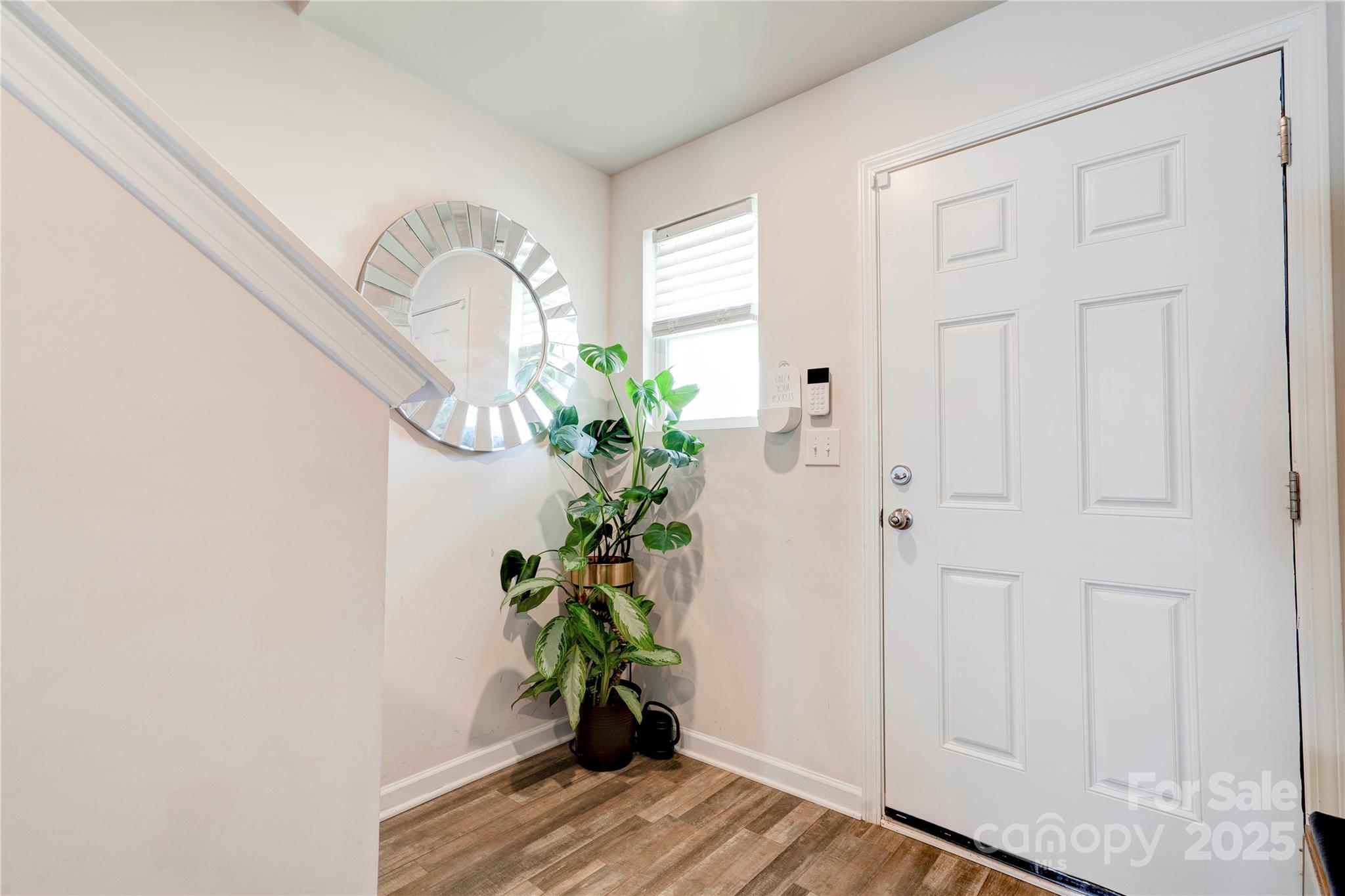 2344 Joes Lake Road Shelby, NC 28152 - Photo 18 of 47 a potted plant sitting in front of a window