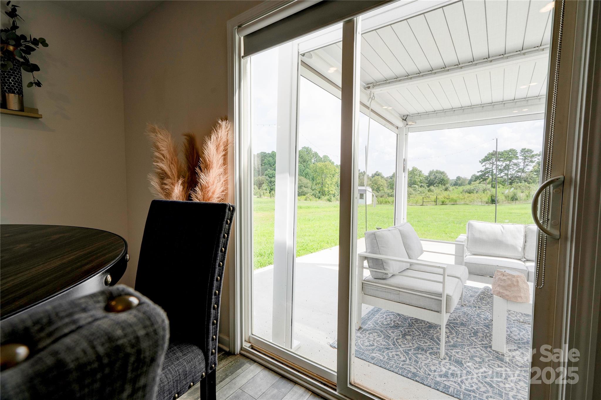 2344 Joes Lake Road Shelby, NC 28152 - Photo 31 of 47 a room with furniture and a floor to ceiling window