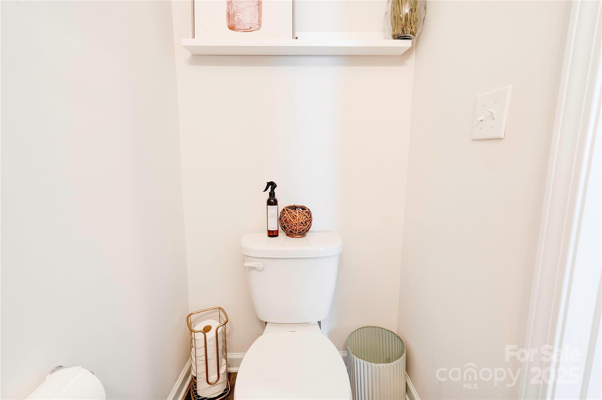 2344 Joes Lake Road Shelby, NC 28152 - Photo 41 of 47 a white toilet sitting next to a bathroom sink