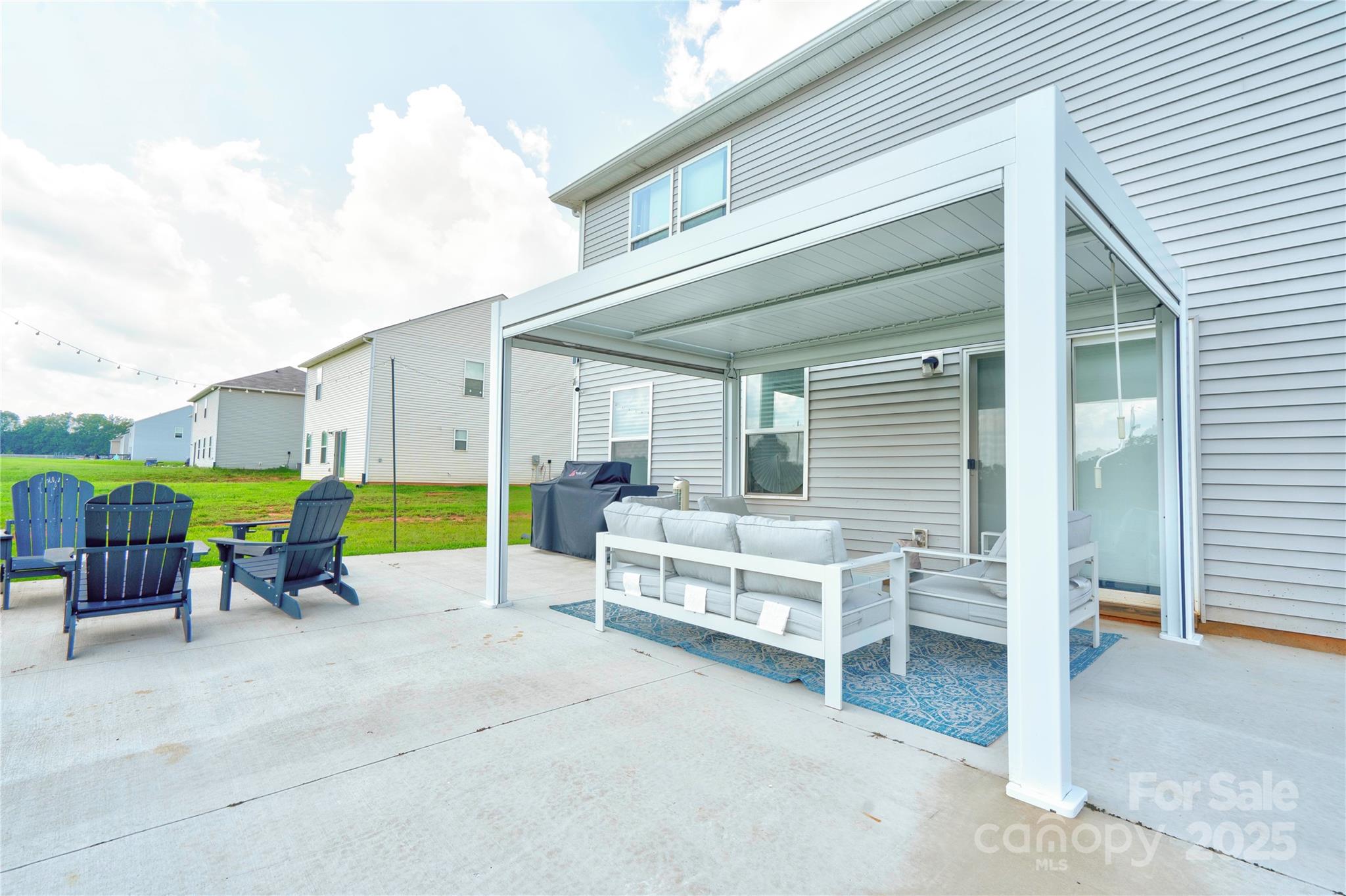 2344 Joes Lake Road Shelby, NC 28152 - Photo 9 of 47 a view of a patio with a table and chairs