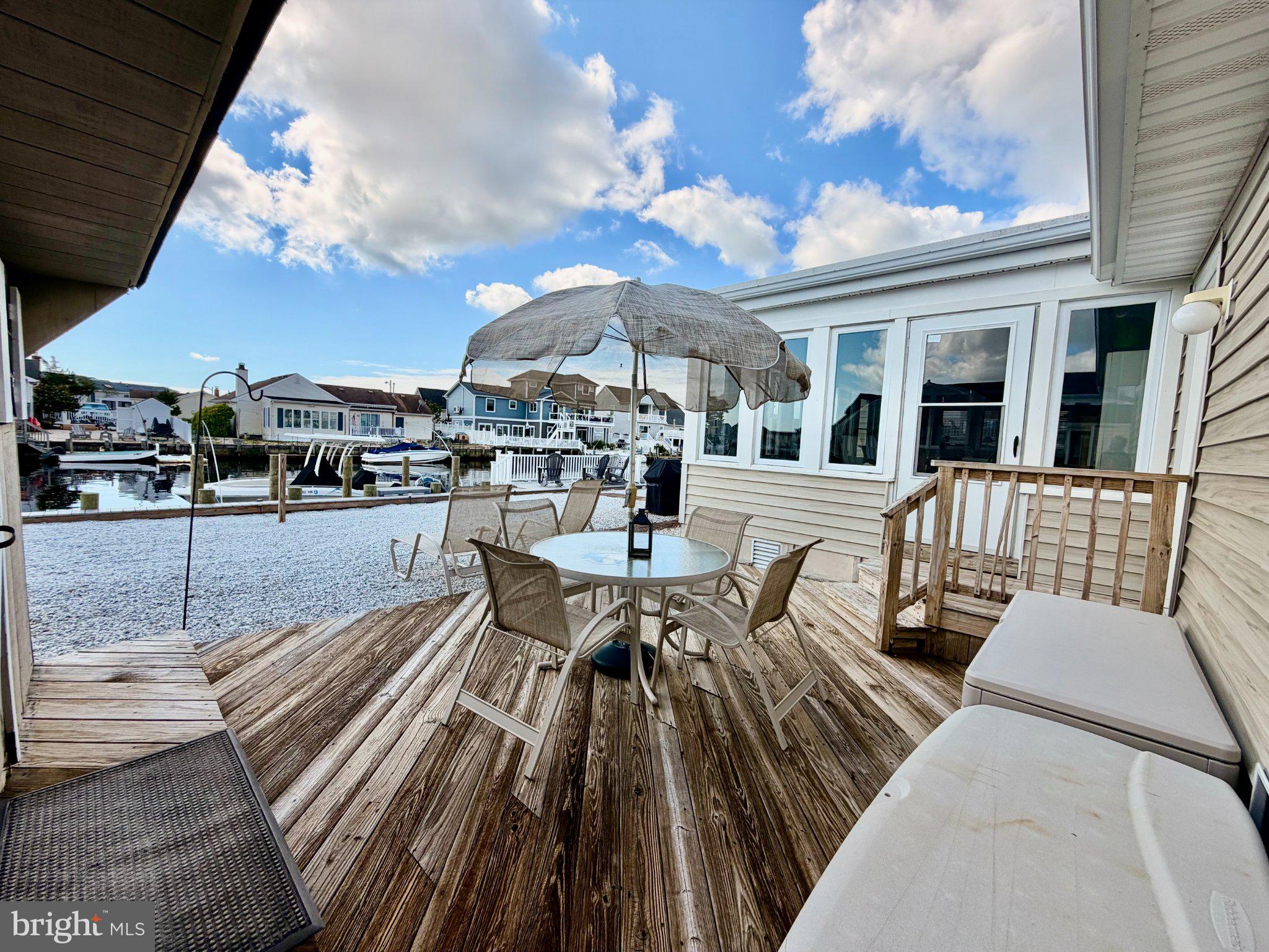 211 William Cook Boulevard Manahawkin, NJ 08050 - Photo 57 of 71 Charming waterfront deck retreat.