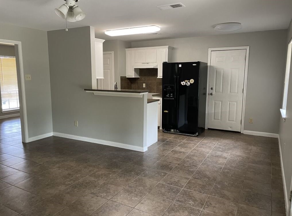 10715 Segrest Drive Houston, TX 77047 - Photo 2 of 9 a view of kitchen with refrigerator and window