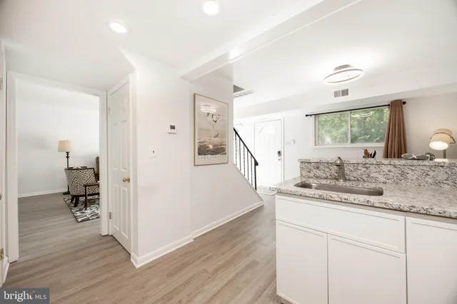 a view of a kitchen from the hallway