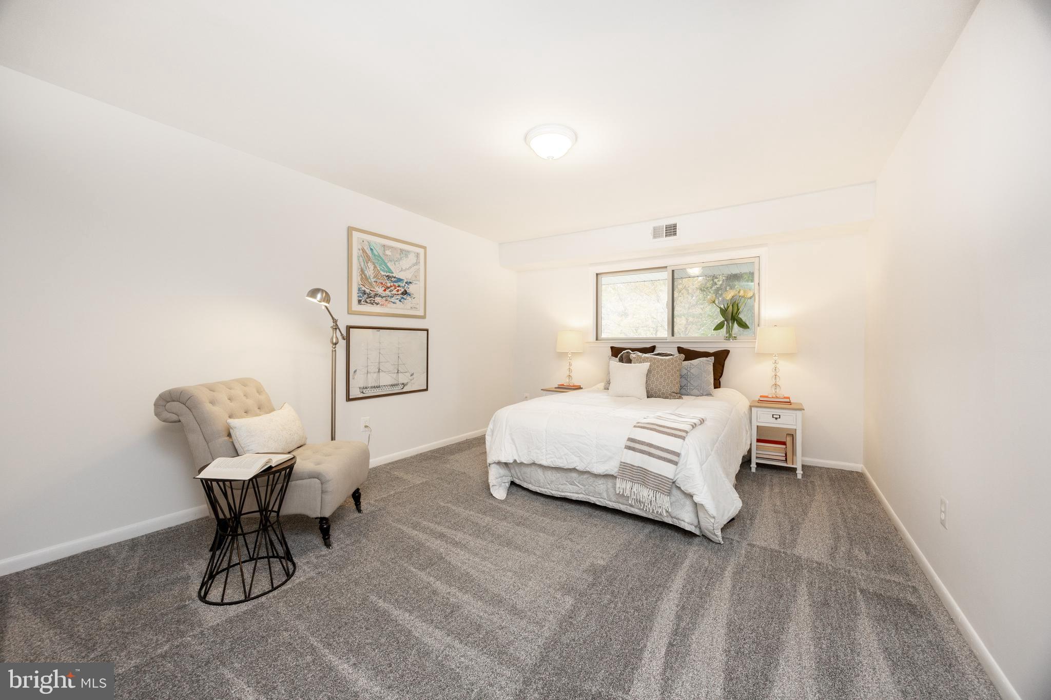 1518 Manley Road, Unit B17 West Chester, PA 19382 - Photo 14 of 25 a bedroom with a bed and a chandelier