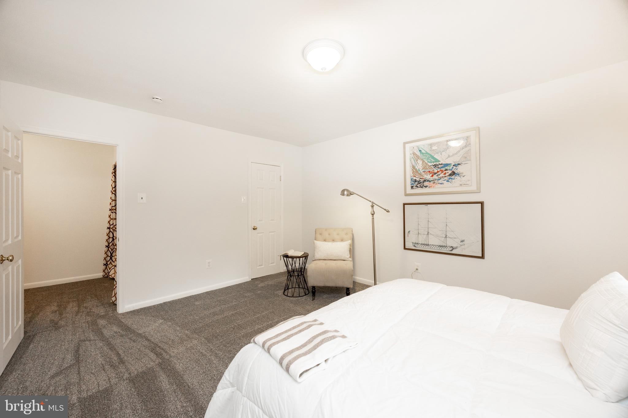 1518 Manley Road, Unit B17 West Chester, PA 19382 - Photo 15 of 25 a bedroom with a bed and a painting on the wall