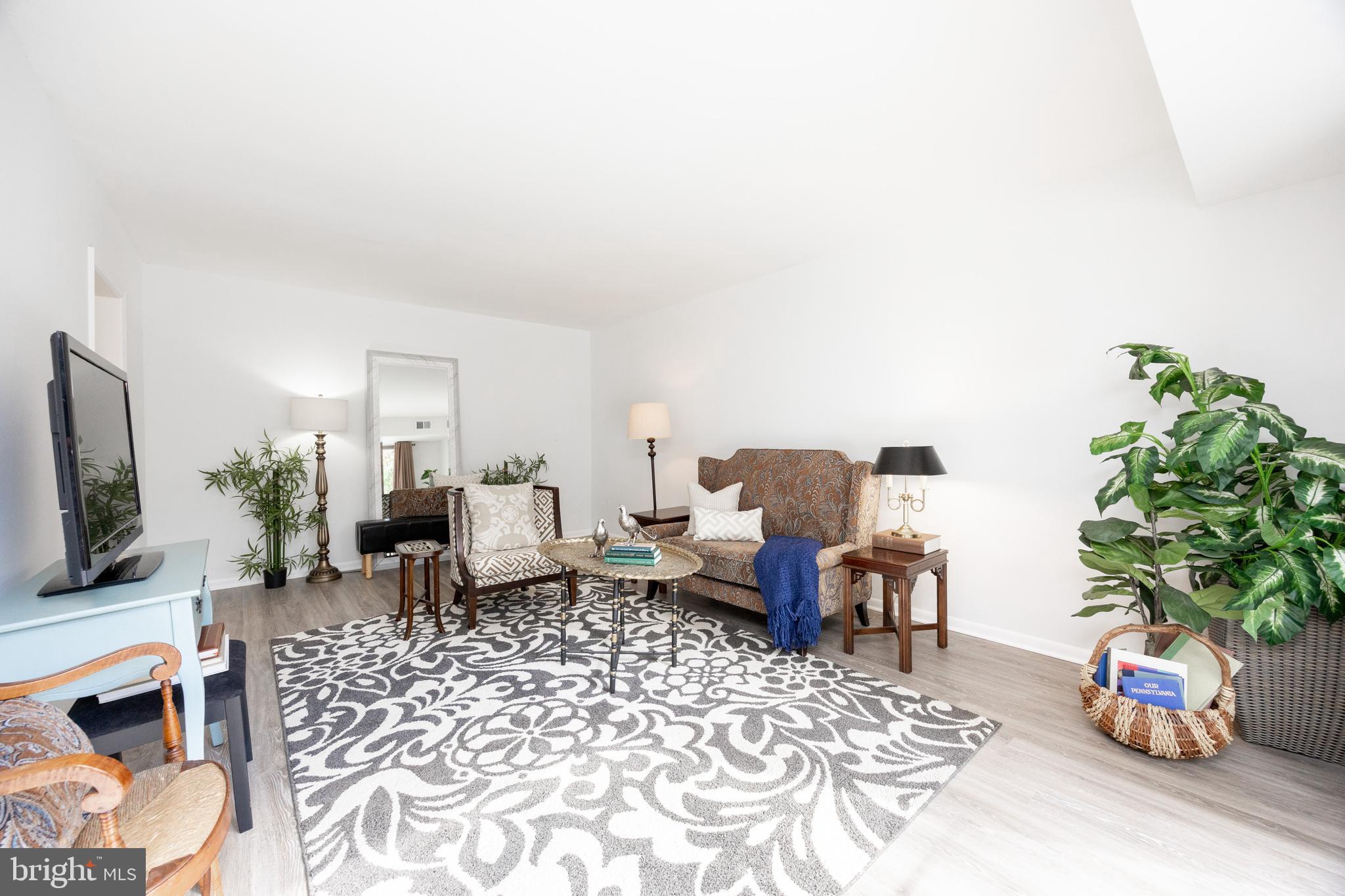 1518 Manley Road, Unit B17 West Chester, PA 19382 - Photo 3 of 25 a living room with furniture and a flat screen tv