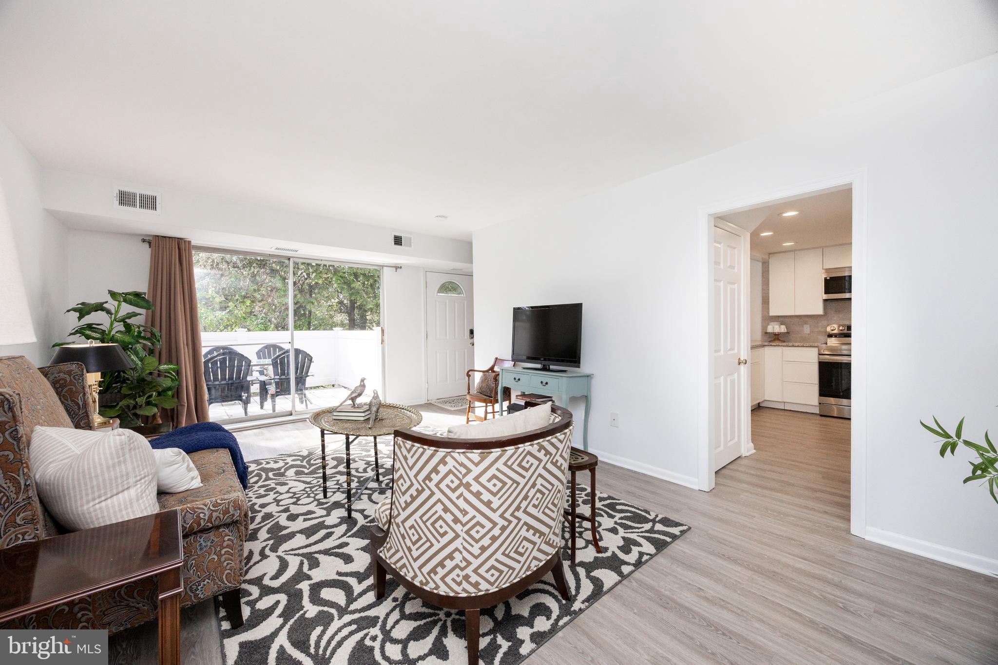 1518 Manley Road, Unit B17 West Chester, PA 19382 - Photo 4 of 25 a living room with furniture and a flat screen tv