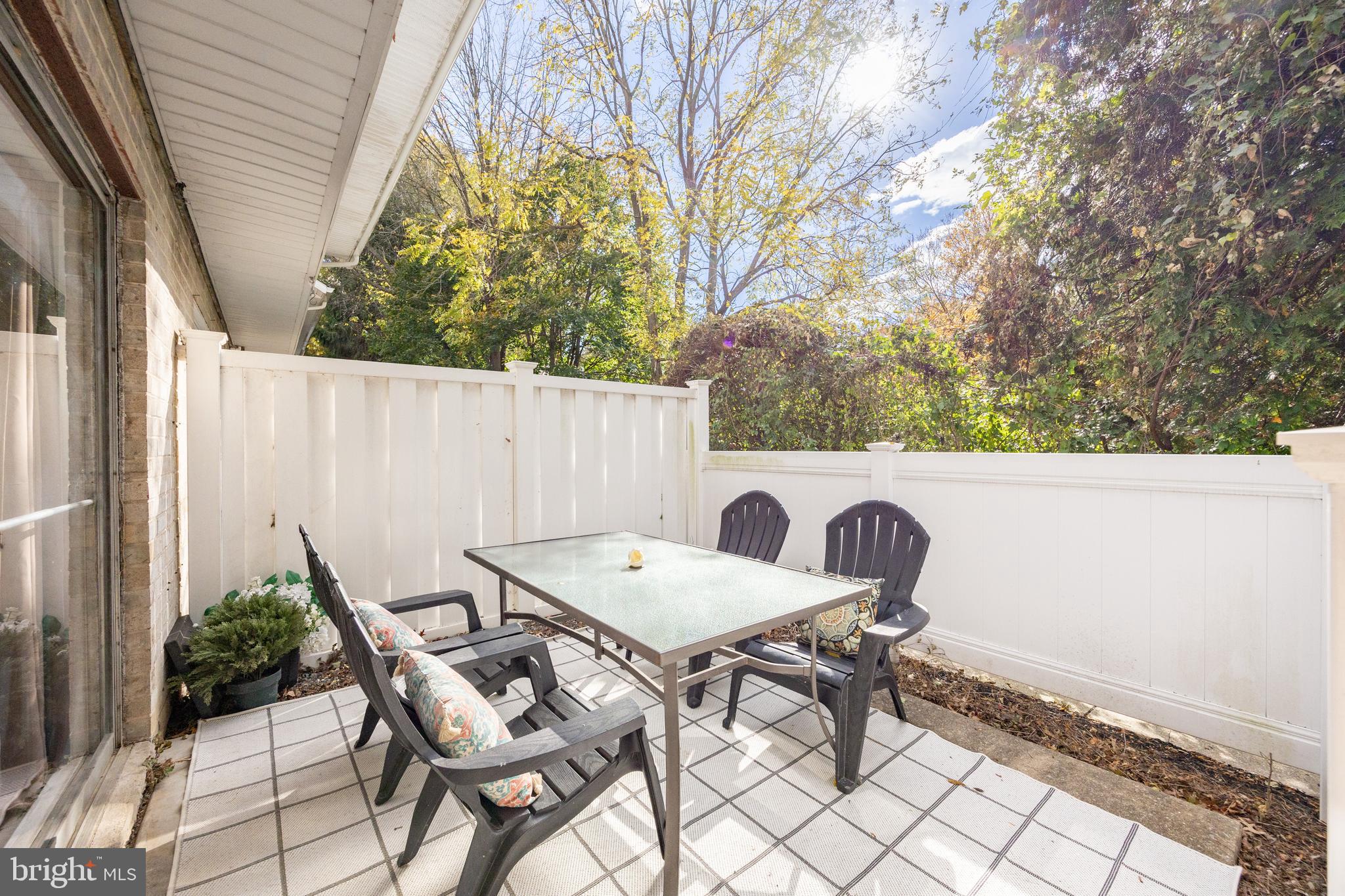 1518 Manley Road, Unit B17 West Chester, PA 19382 - Photo 5 of 25 a view of a patio with table and chairs and potted plants