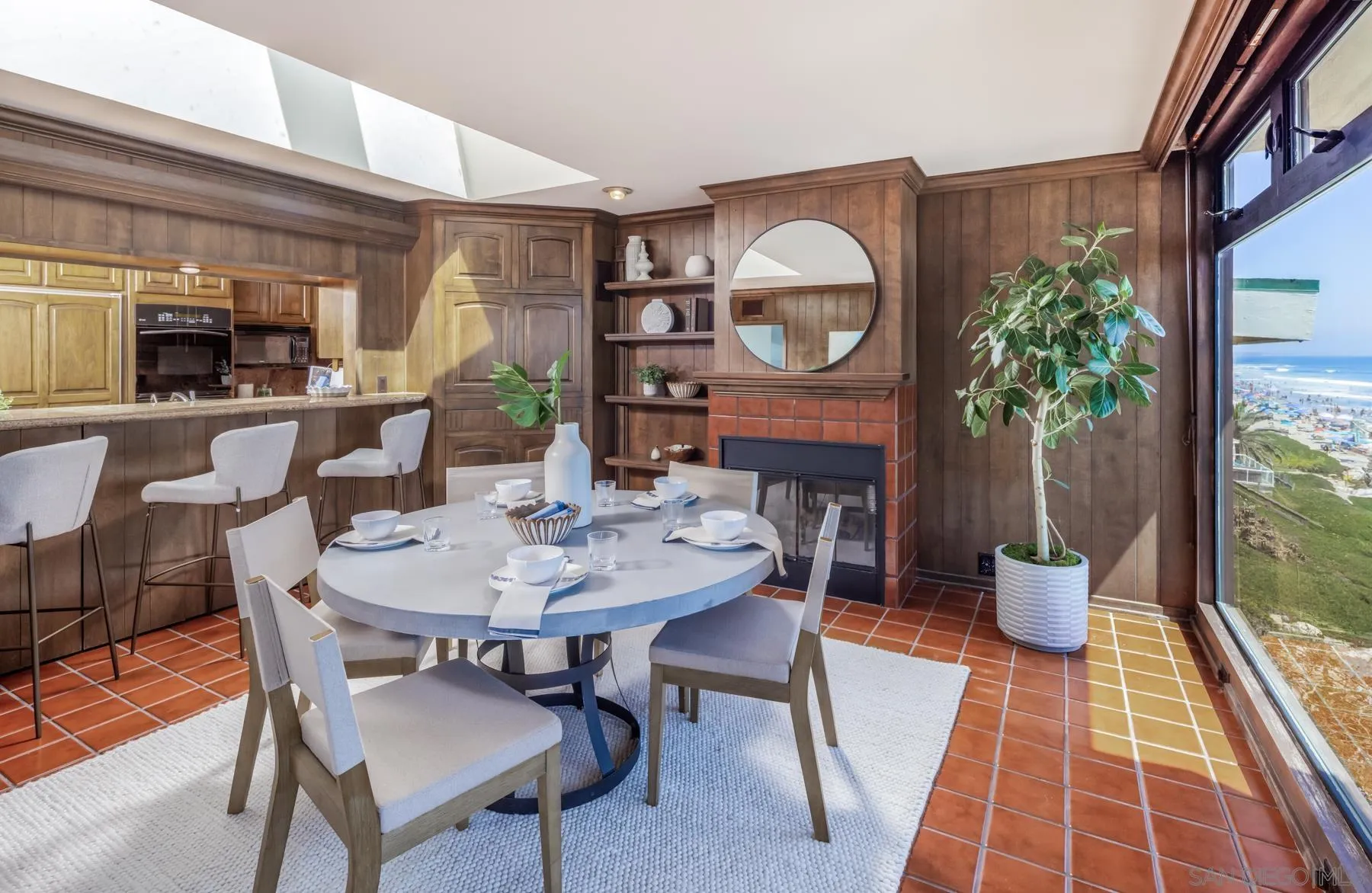 2977 Ocean Street Carlsbad, CA 92008 - Photo 12 of 44 a dining room with furniture window and wooden floor