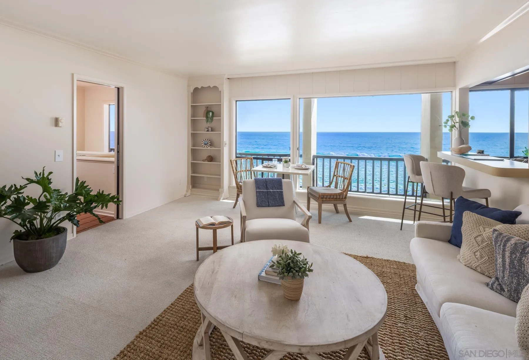 2977 Ocean Street Carlsbad, CA 92008 - Photo 19 of 44 a living room with furniture potted plant and kitchen view