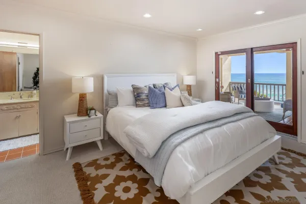 a bed room with a bed and a lamp