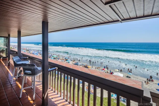 a view of a balcony with wooden floor