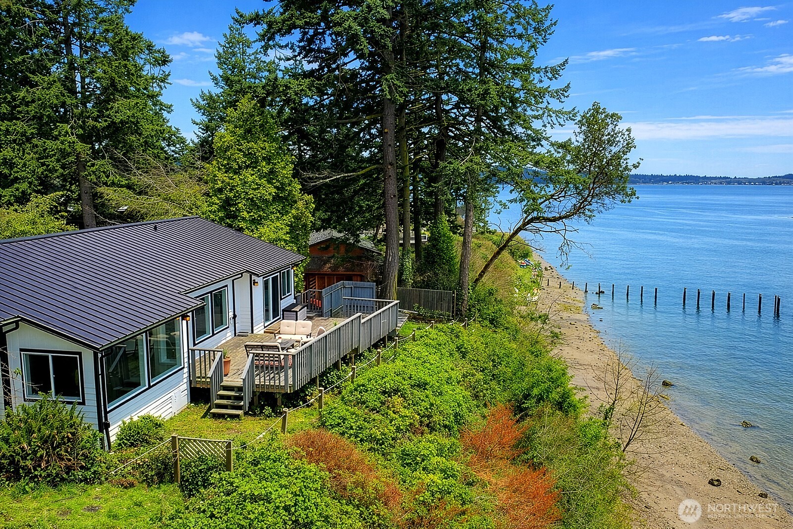 2999 Saratoga Road Langley, WA 98260 - Photo 5 of 40 a aerial view of a house with swimming pool and porch with furniture