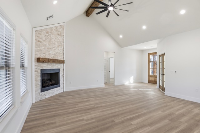 17 Wilson Loop Durant, OK 74701 - Photo 2 of 6 Vaulted ceiling with exposed wood beam, recessed lighting, and a ceiling fan