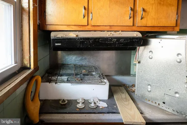 a kitchen with a stove and a microwave oven