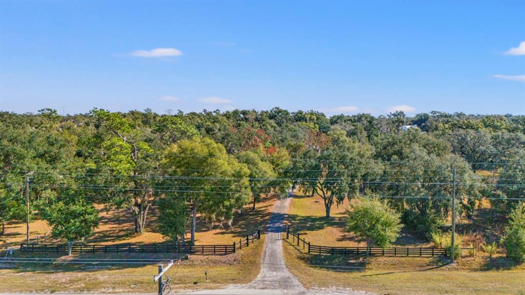 12414 Fort King Road Dade City, FL 33525 - Photo 2 of 60 a view of a lake with houses