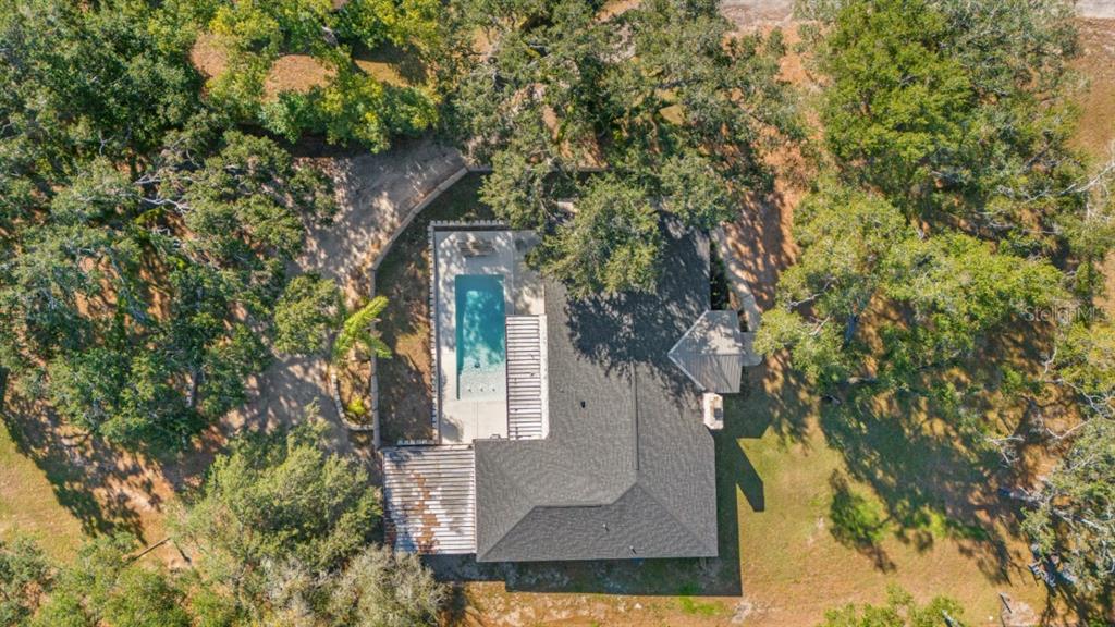 12414 Fort King Road Dade City, FL 33525 - Photo 5 of 60 a view of a house with a tree