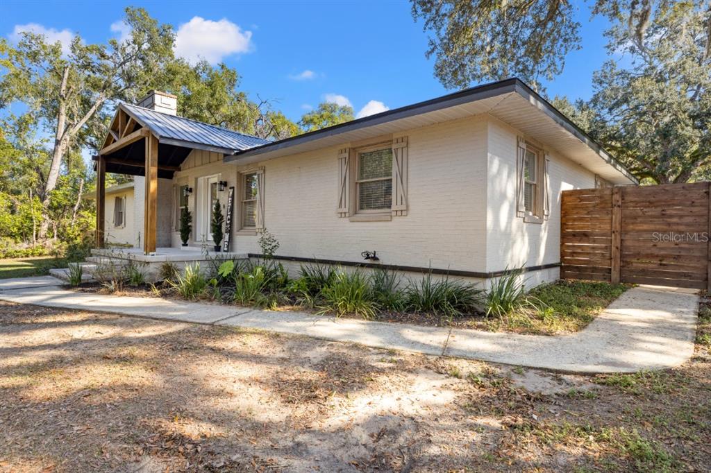 12414 Fort King Road Dade City, FL 33525 - Photo 10 of 60 a front view of a house with a yard