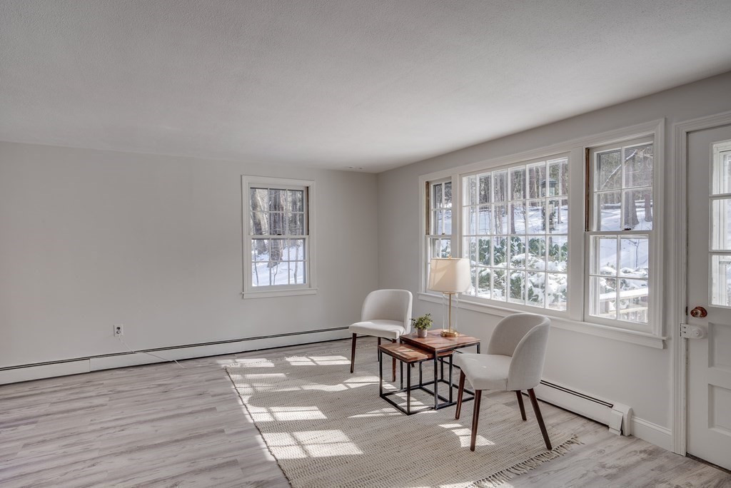 76 Brook Trail Road Concord, MA 01742 - Photo 13 of 33 a workspace with wooden floor and a window