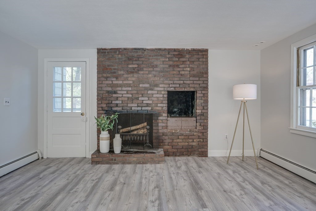 76 Brook Trail Road Concord, MA 01742 - Photo 16 of 33 an empty room with furniture and a fireplace
