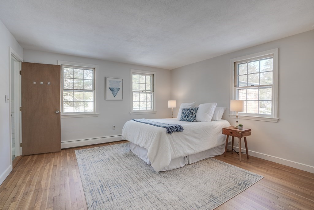 76 Brook Trail Road Concord, MA 01742 - Photo 19 of 33 a bed room with a bed and a chair