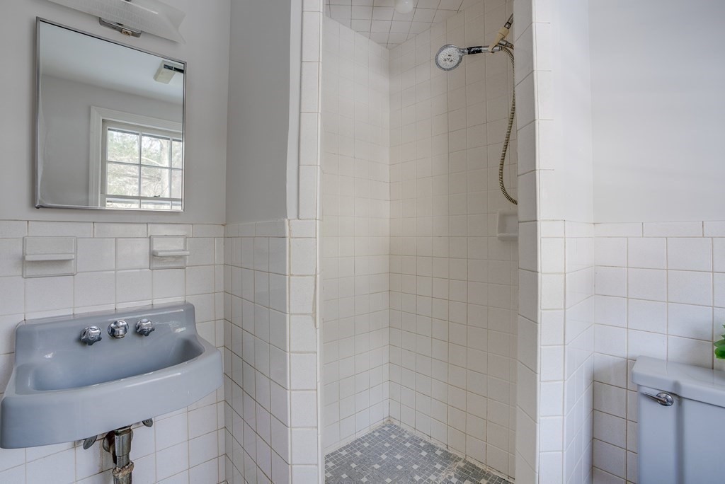76 Brook Trail Road Concord, MA 01742 - Photo 20 of 33 a bathroom with a sink and shower