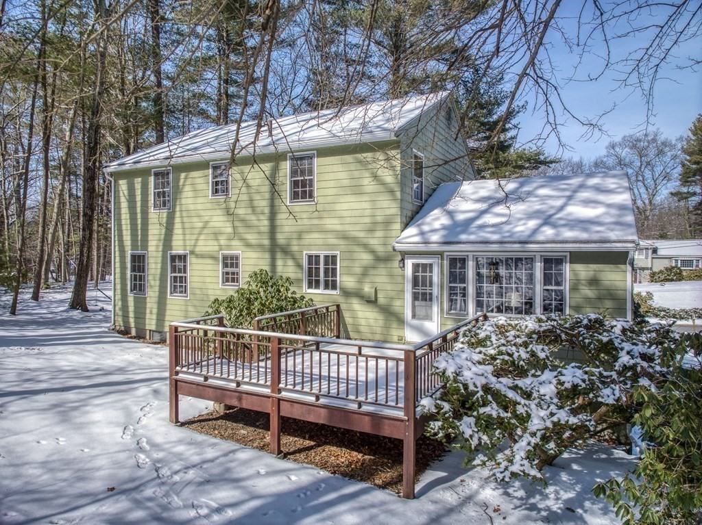 76 Brook Trail Road Concord, MA 01742 - Photo 2 of 33 a view of a brick house with a small yard and large trees