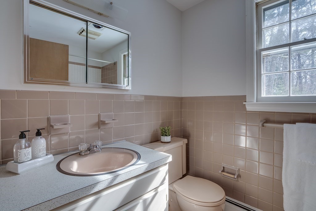 76 Brook Trail Road Concord, MA 01742 - Photo 24 of 33 a bathroom with a toilet a sink and a mirror