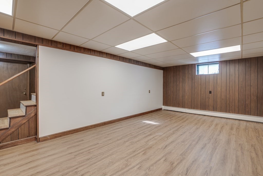 76 Brook Trail Road Concord, MA 01742 - Photo 25 of 33 a view of an empty room with wooden floor