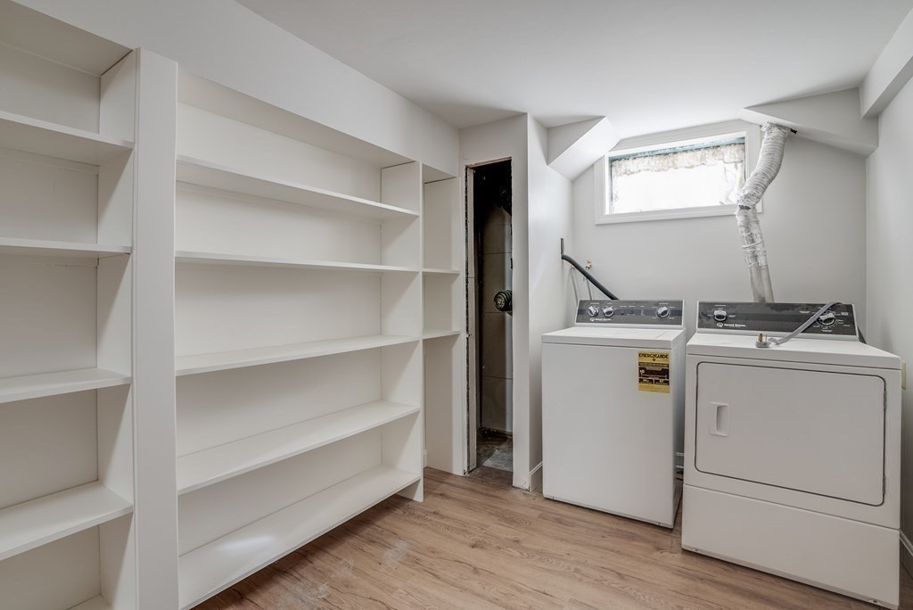 76 Brook Trail Road Concord, MA 01742 - Photo 27 of 33 a utility room with cabinets dryer and washer