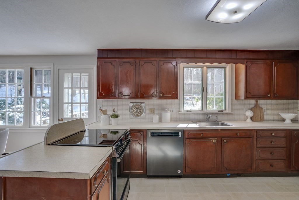 76 Brook Trail Road Concord, MA 01742 - Photo 9 of 33 a kitchen with a sink and cabinets