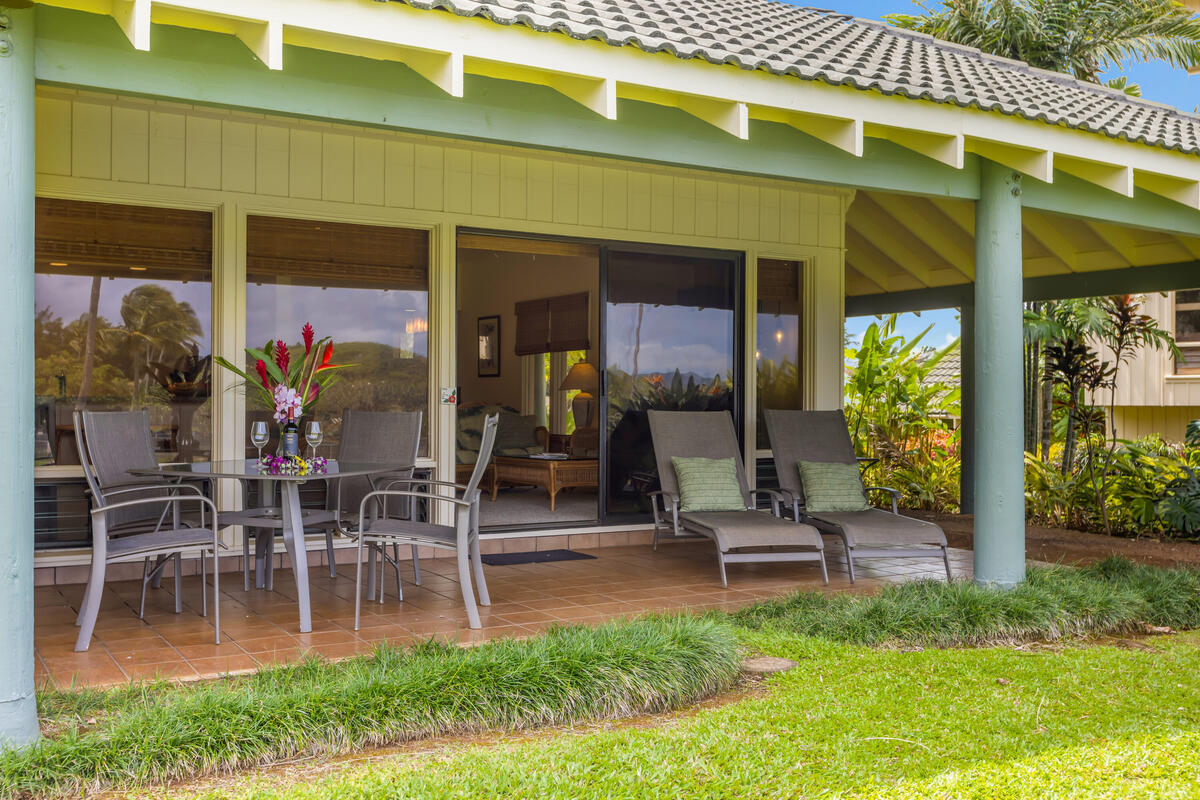 2371 Ho'ohu Road, Unit 801 Koloa, HI 96756 - Photo 12 of 28 a view of a swimming pool with a table and chairs