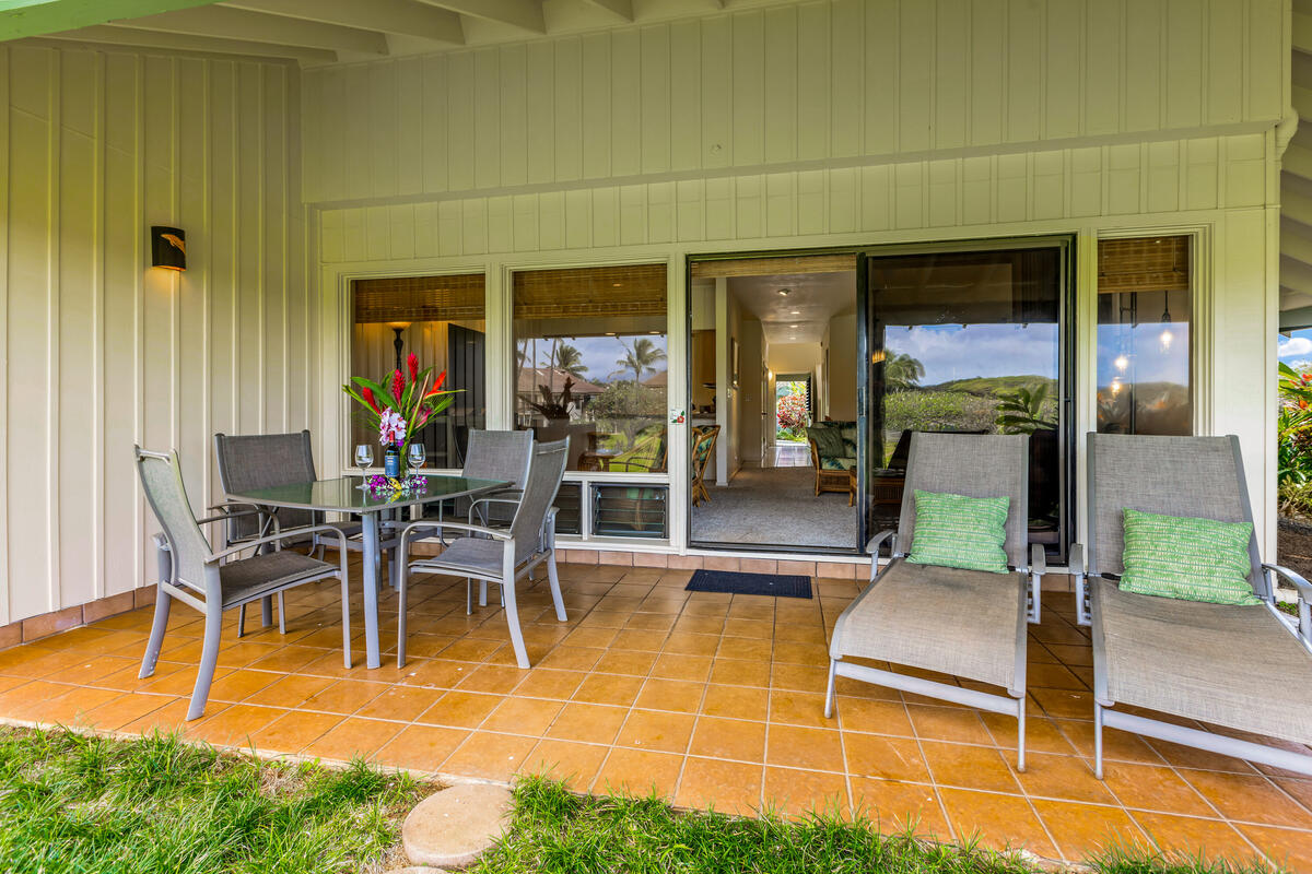 2371 Ho'ohu Road, Unit 801 Koloa, HI 96756 - Photo 13 of 28 a view of a patio with table and chairs with wooden floor