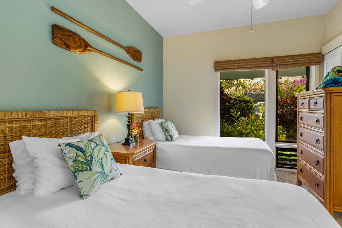 2371 Ho'ohu Road, Unit 801 Koloa, HI 96756 - Photo 14 of 28 a bedroom with a bed and window