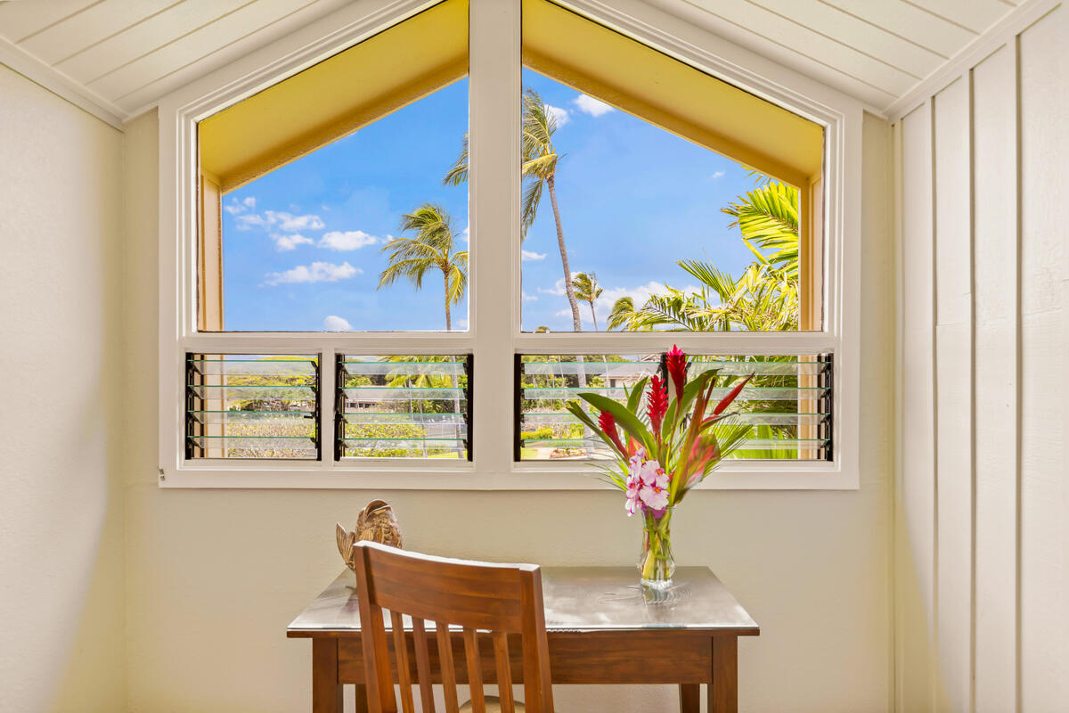 2371 Ho'ohu Road, Unit 801 Koloa, HI 96756 - Photo 17 of 28 a vase with flowers sitting on a table