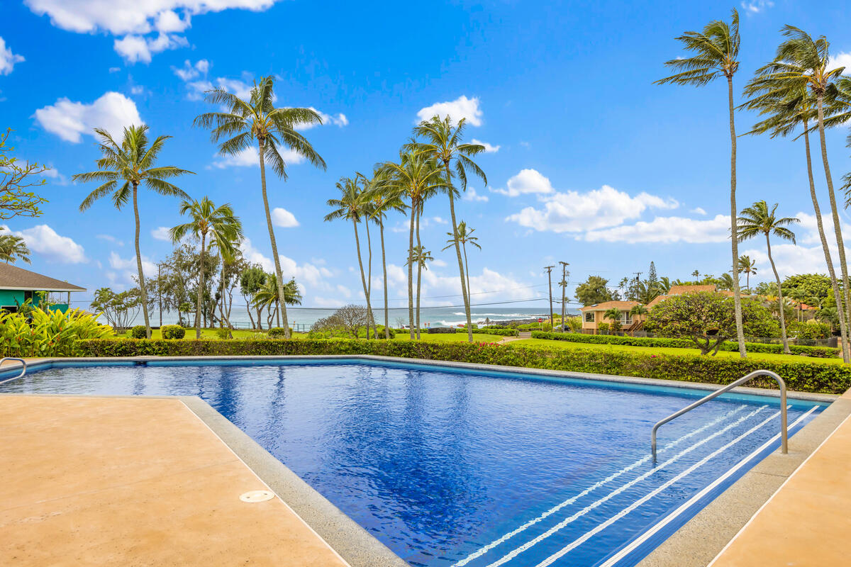 2371 Ho'ohu Road, Unit 801 Koloa, HI 96756 - Photo 2 of 28 a view of swimming pool with a table and chairs