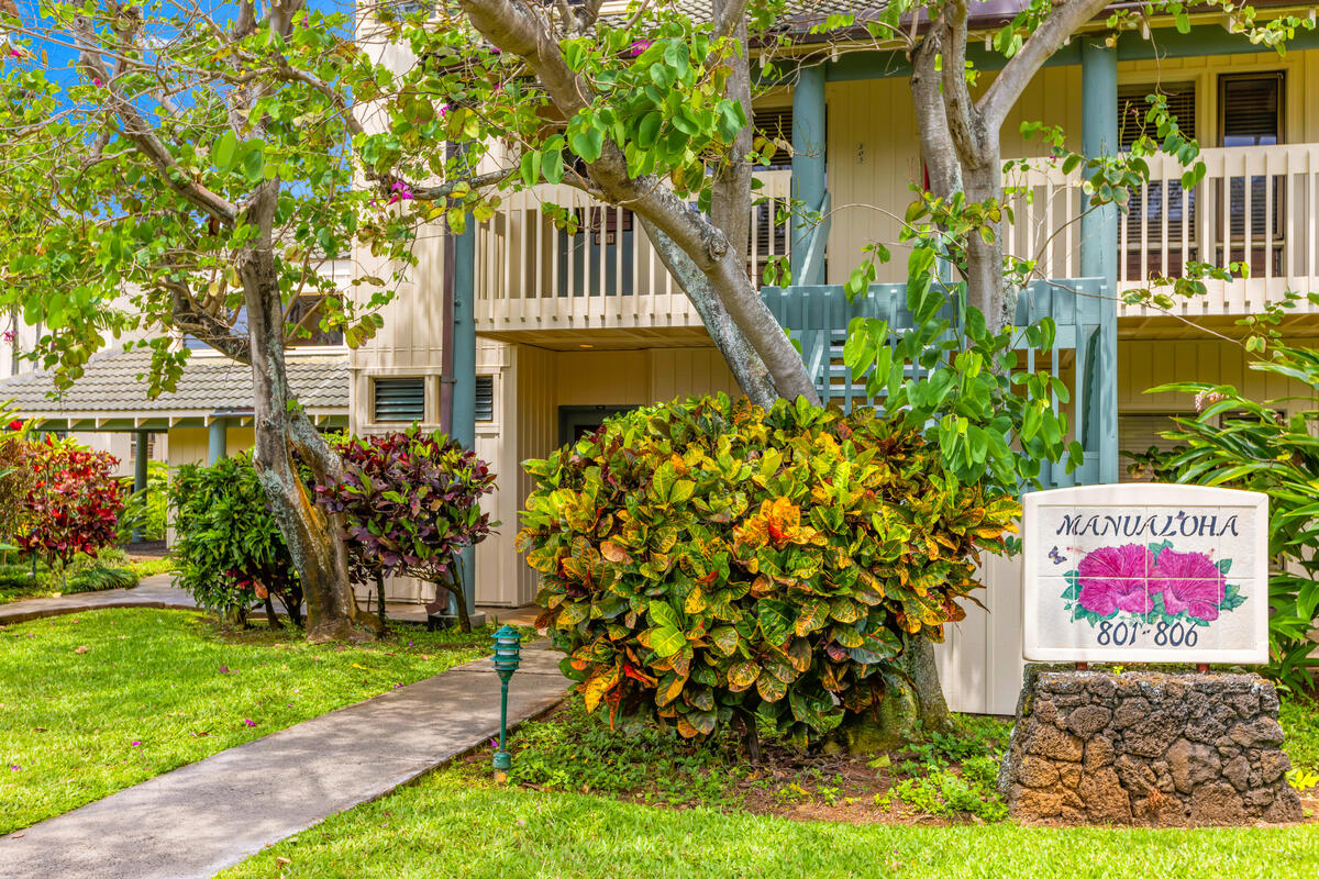 2371 Ho'ohu Road, Unit 801 Koloa, HI 96756 - Photo 3 of 28 a view of a house with a yard and garden