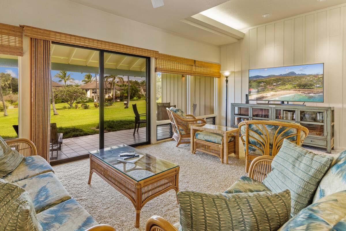 2371 Ho'ohu Road, Unit 801 Koloa, HI 96756 - Photo 8 of 28 a living room with furniture floor to ceiling window and floor to ceiling window