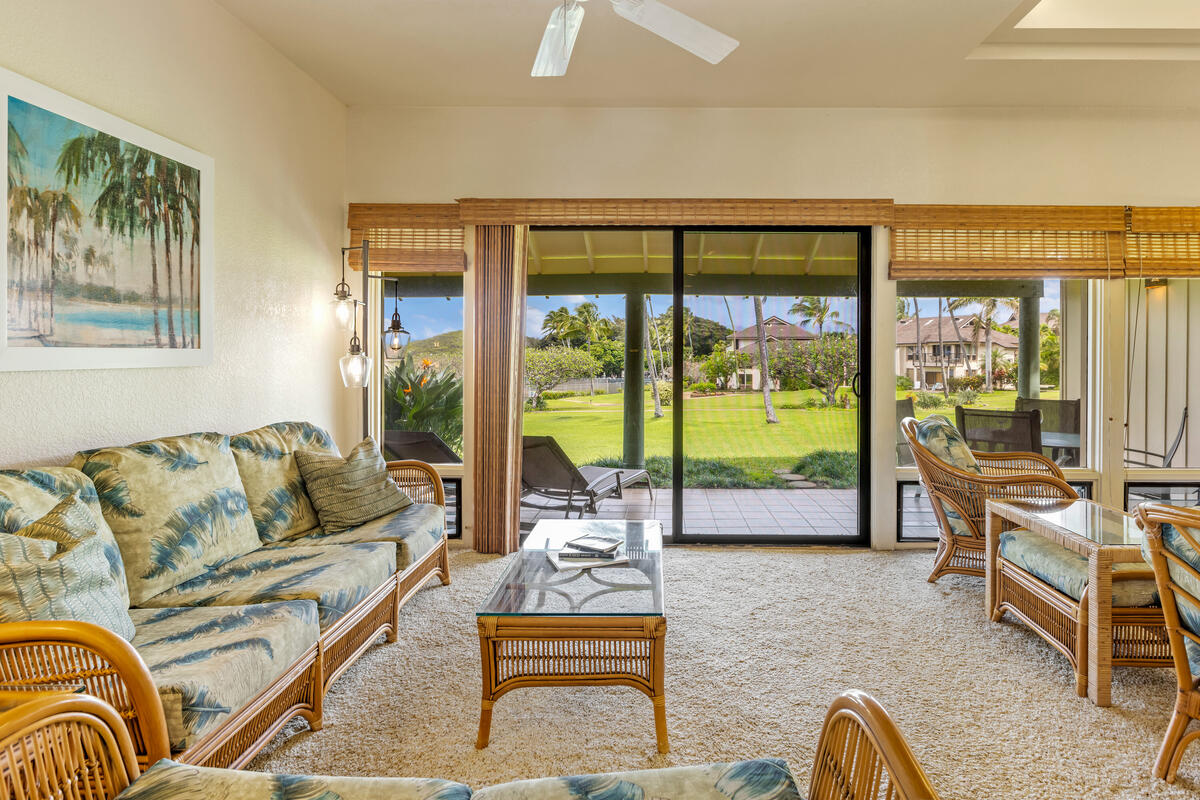 2371 Ho'ohu Road, Unit 801 Koloa, HI 96756 - Photo 9 of 28 a living room with furniture and large windows