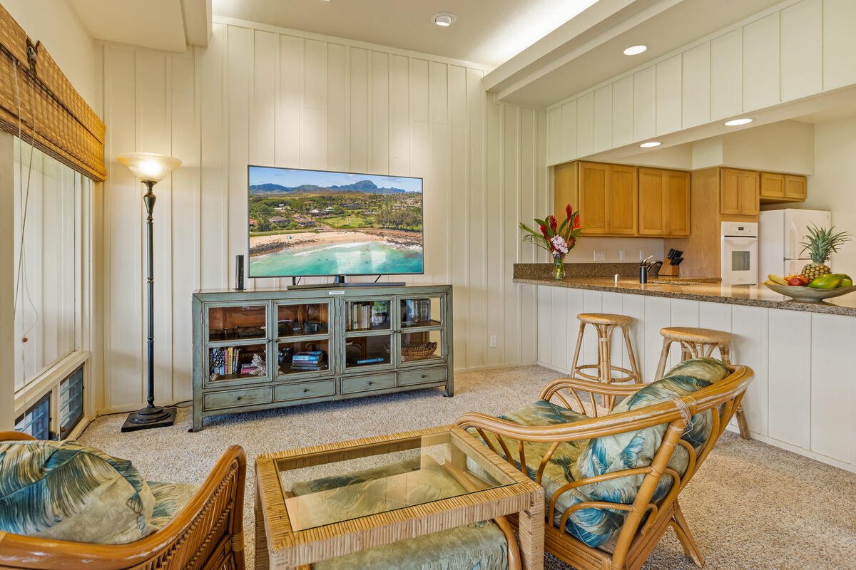 2371 Ho'ohu Road, Unit 801 Koloa, HI 96756 - Photo 10 of 28 a kitchen with stainless steel appliances granite countertop a stove a sink and a microwave