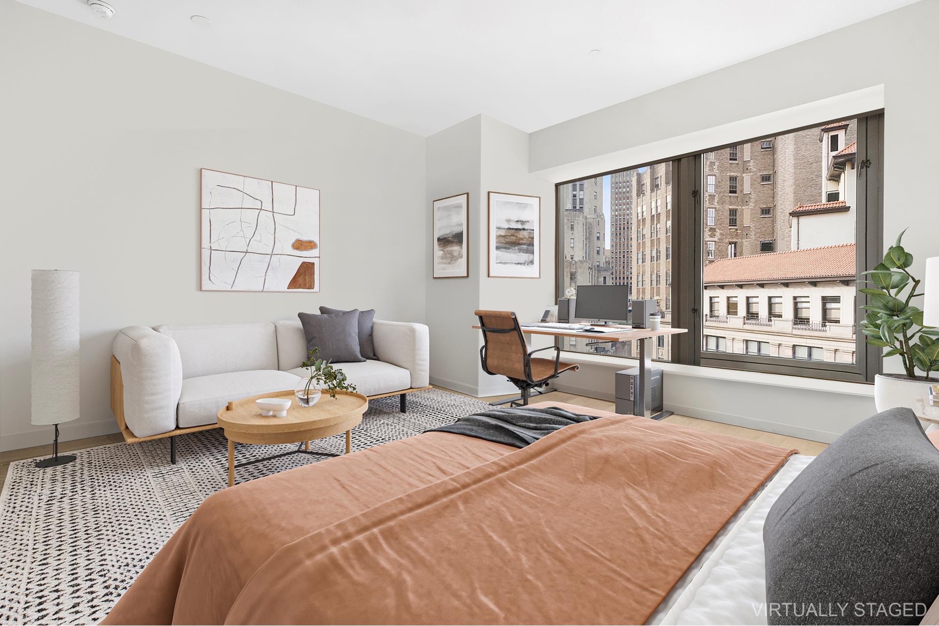 75 Wall Street, Unit 27J Manhattan, NY 10005 - Photo 1 of 8 a bedroom with furniture and a large window