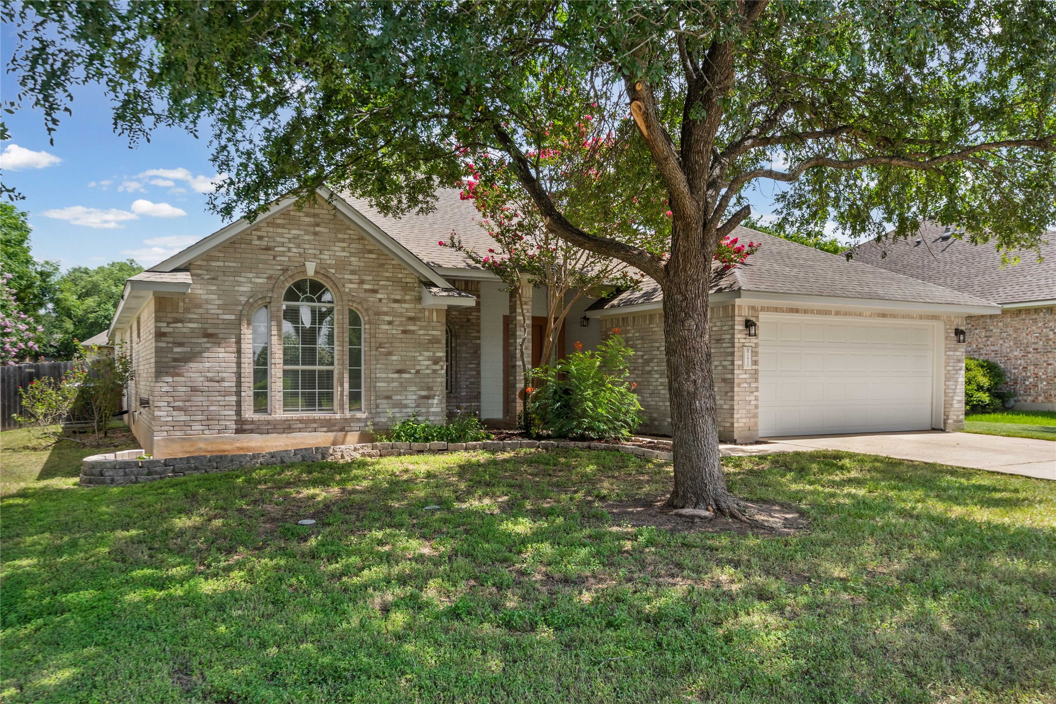 2920 Warwick Way Austin, TX 78748 - Photo 33 of 36 A classic brick exterior offers enduring appeal, complemented by mature landscaping and a two-car garage