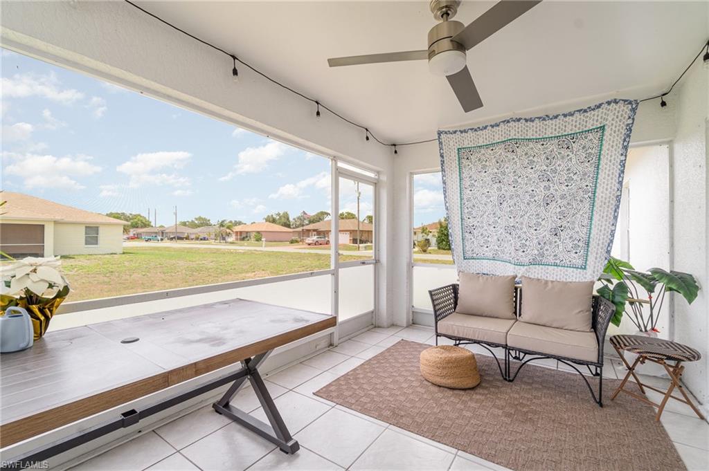 879 Rue Labeau Circle Fort Myers, FL 33913 - Photo 24 of 27 a living room with furniture and a large window