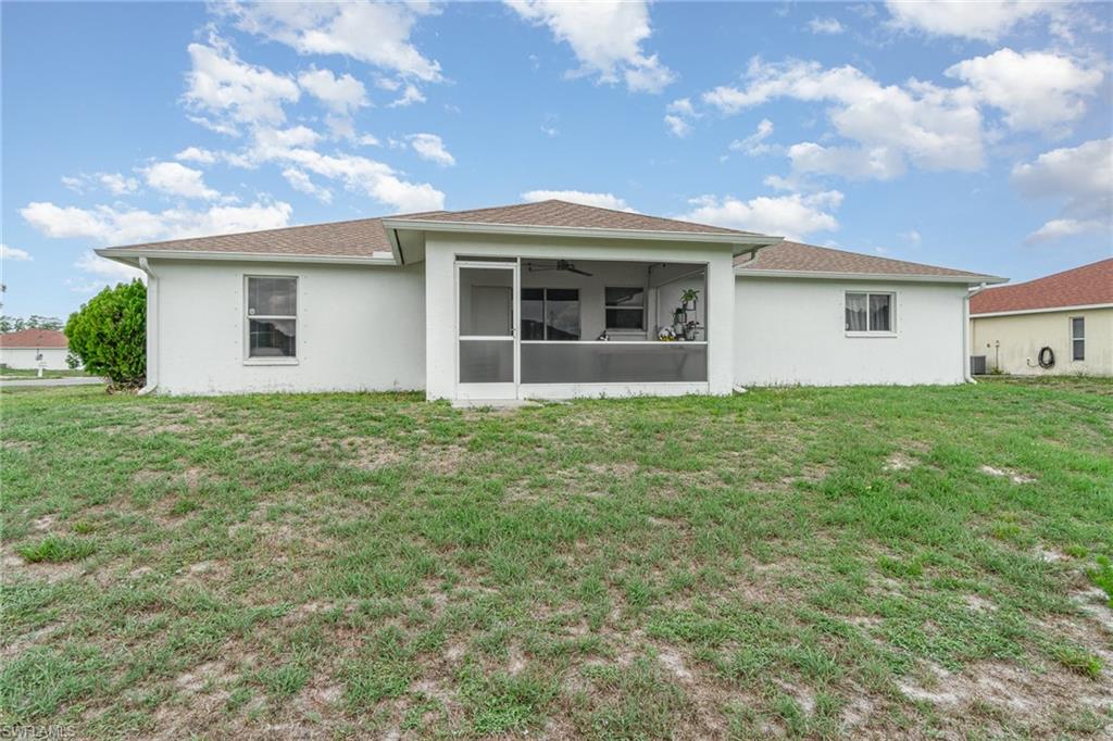 879 Rue Labeau Circle Fort Myers, FL 33913 - Photo 26 of 27 a front view of a house with a garden